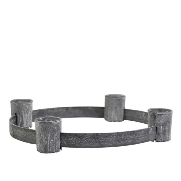 Fritlagt produktbillede af rund adventsstage i antik zink med fire aftagelige lysholdere p� ren hvid baggrund.