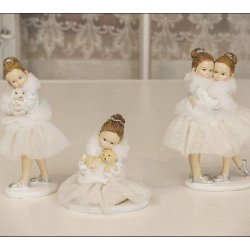 ekorationsfigurer fra La Vida af veninderne Anna og Elsa samt piger med kanin og hundehvalp.