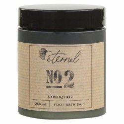 En m�rk krukke med Eternel Fodbadesalt No. 2 med citrongr�s p� 250 ml, vist p� en hvid baggrund.