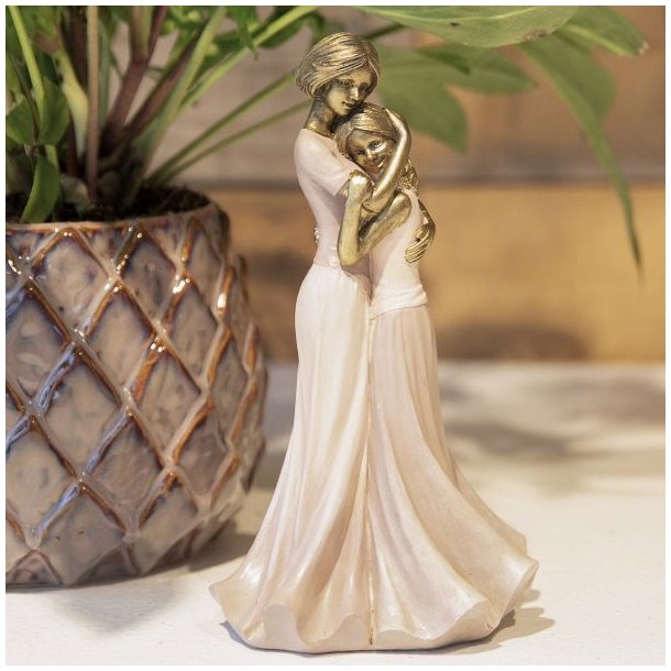 La Vida skulptur af mor og datter i lyser�de kjoler