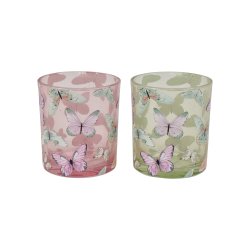 Fritlagt billede af to sm� fyrfadsstager i glas i farverne gr�n og rosa med hvidt sommerfugleprint.