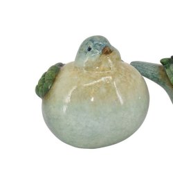 En tyk keramikfugl med gr�nne vinger og bl�lig krop, der kigger lige frem. St�rrelse: H13 / L20 cm.
