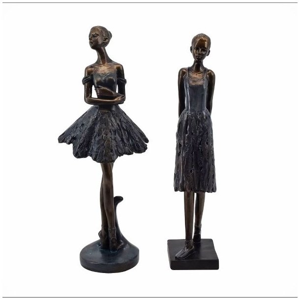 Gyldne ballerinafigur med flot m�rkebl� kjoler i en graci�s dansepositioner