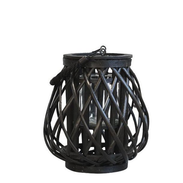 N�rbillede af den lille sorte fletlanterne, der st�r alene p� gulvet.