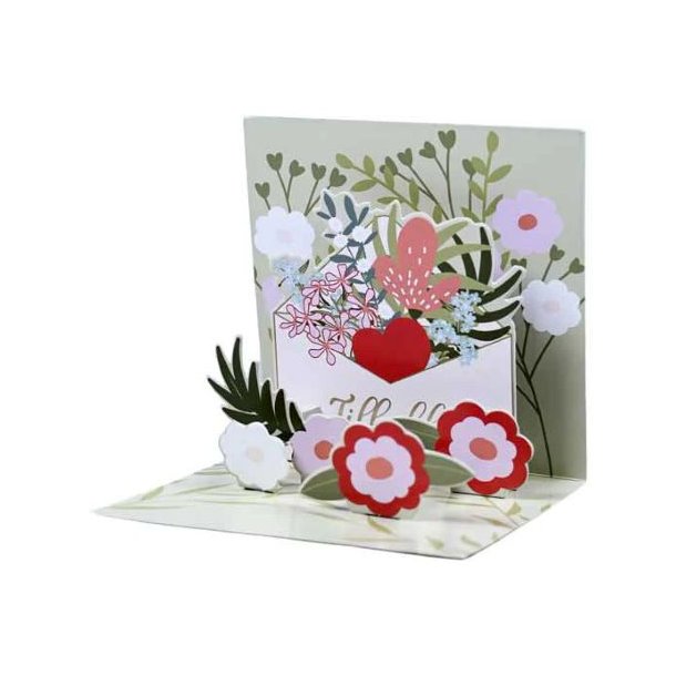 �bent 3D pop-up lyk�nskningskort med motiv af en hvid kuvert fyldt med farverige blomster og et stort r�dt hjerte i et elegant naturdesign.